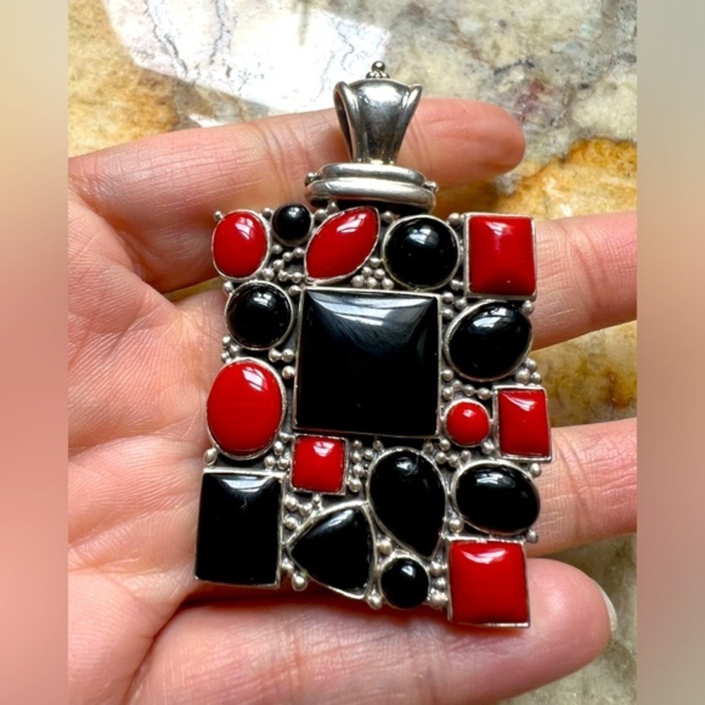 Gorgeous pendant sterling silver with coral and onyx? Stones